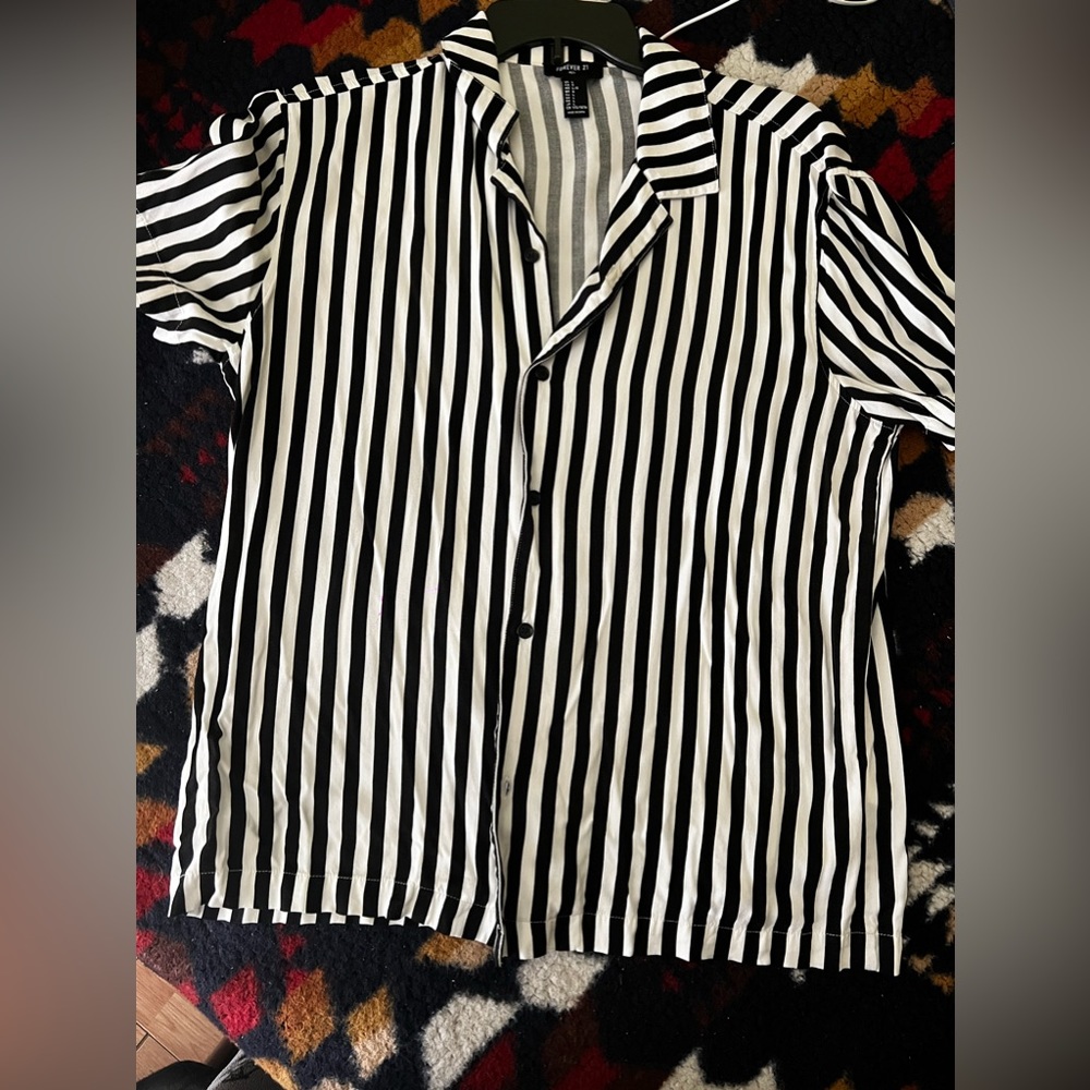 Black and white stripped button up shirt.